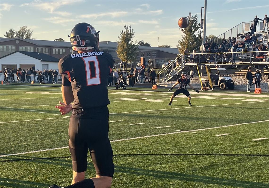 Liberty Center quarterback Jack Badenhop throws a pass prior to the Tigers' game against Archbold.