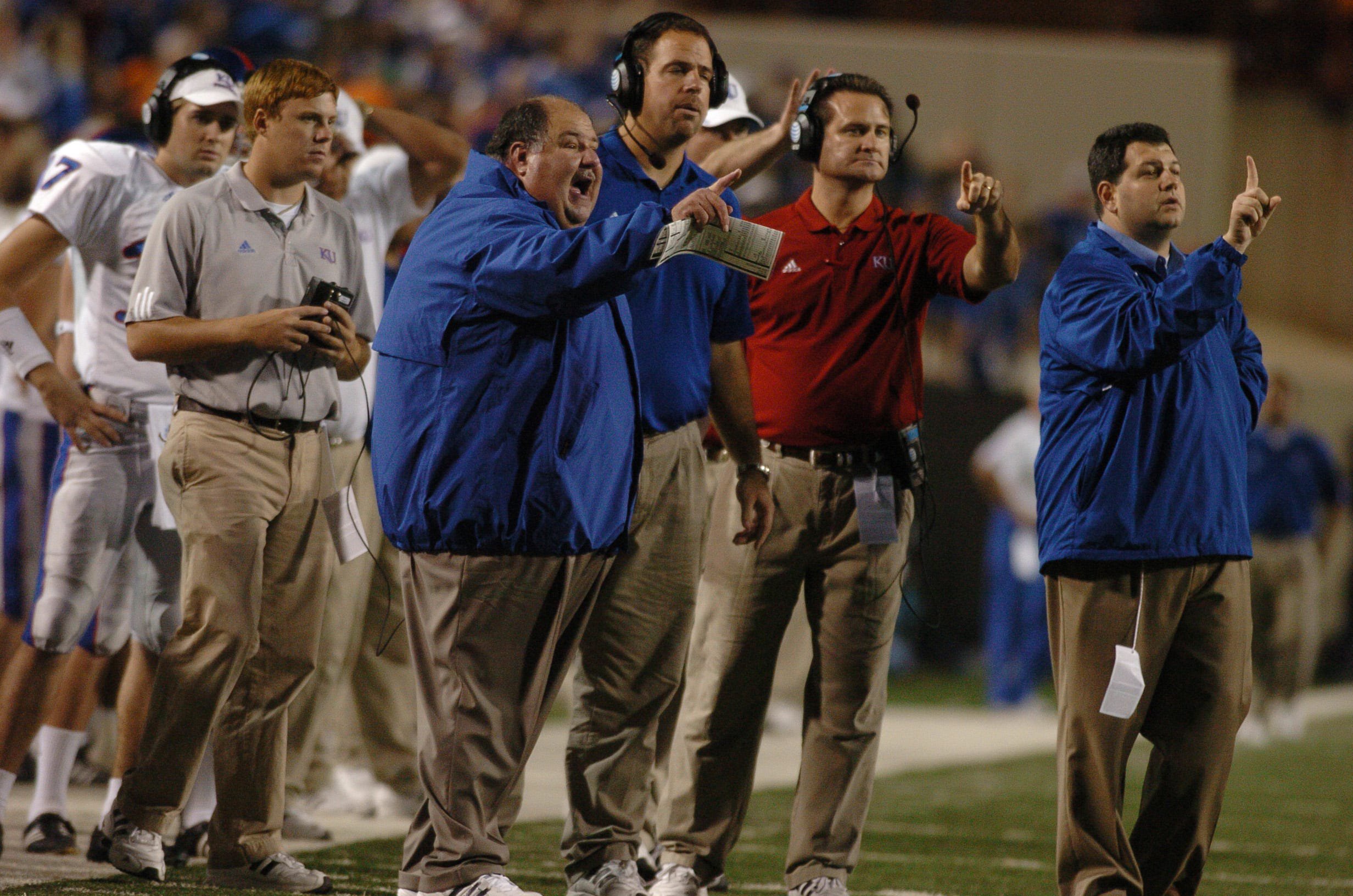 Nov 10, 2007; Stillwater, OK, USA; Kansas Jayhawks head coach Mark Mangino instructs his players against the Oklahoma State Cowboys in the second half at Boone Pickens Stadium in Stillwater, OK. Kansas won the game 43-28. Mandatory Credit: John Rieger-USA TODAY Sports