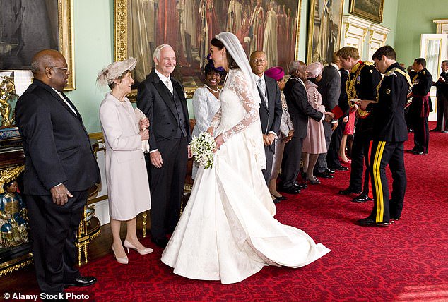 Kate's first dress, designed by Sarah Burton for Alexander McQueen, is arguably the most famous wedding gown of the 21st century