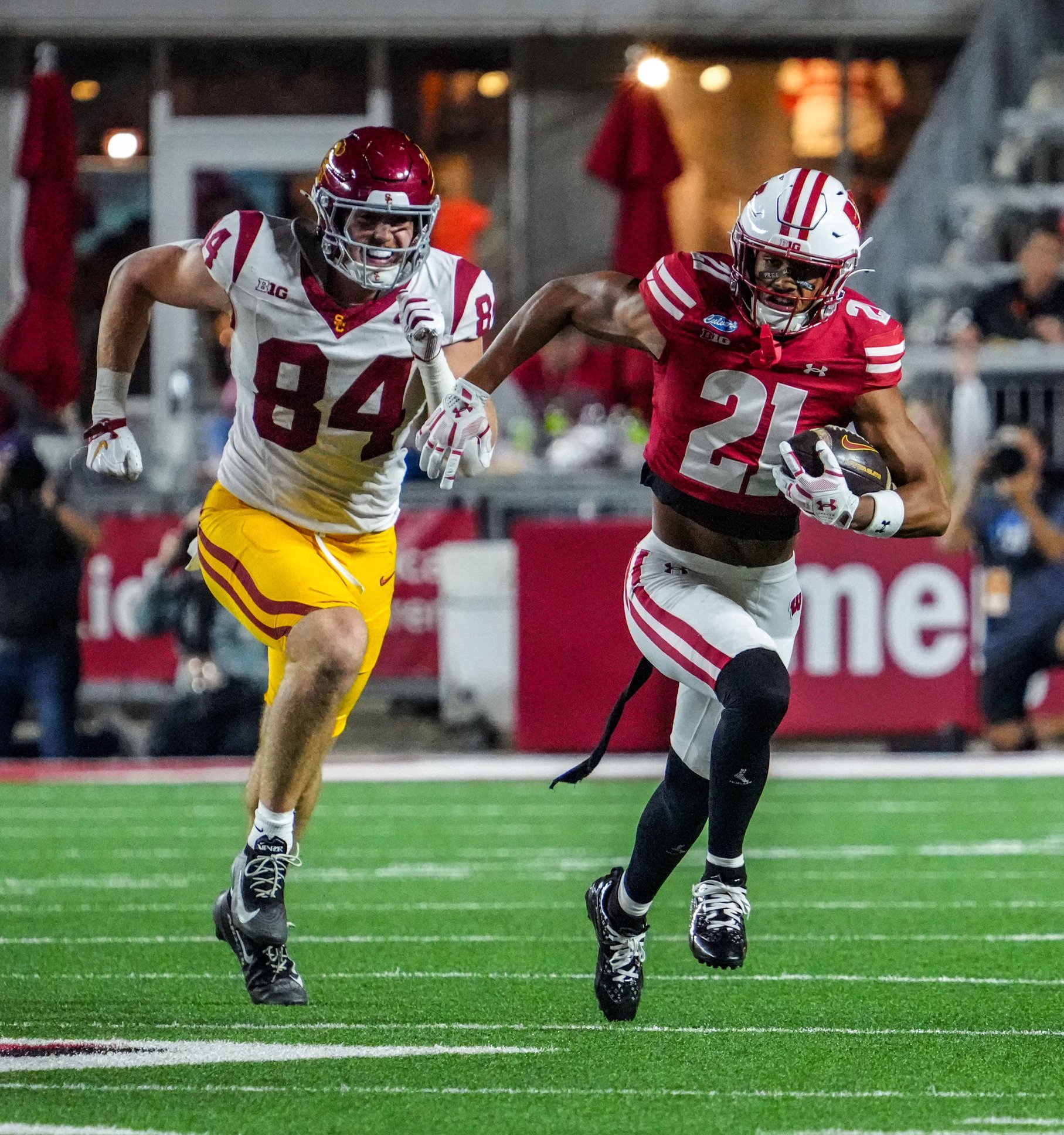 Wisconsin Badgers safety Cairo Skanes (21) races downfield after intercepting a pass in the game against USC, Oct. 24, 2026, at Camp Randall Stadium in Madison, Wisconsin.