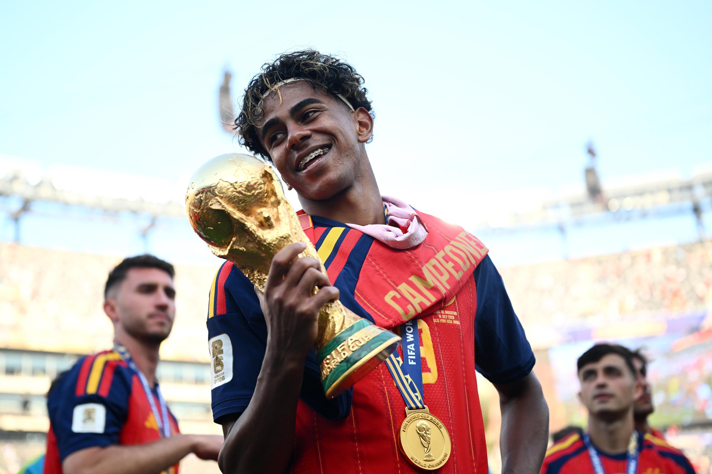EAST RUTHERFORD, NEW JERSEY - JULY 19: Lamine Yamal #19 of Spain celebrates with the FIFA World Cup Winner’s Trophy after the team’s victory following the FIFA World Cup 2026 Final match between Spain and Argentina at New York New Jersey Stadium on July 19, 2026 in East Rutherford, New Jersey. (Photo by Hannah Peters - FIFA/FIFA via Getty Images)