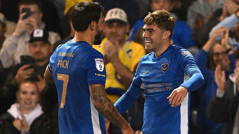 Zak Swanson of Portsmouth celebrates scoring his team’s first goal with team-mate Marlon Pack 