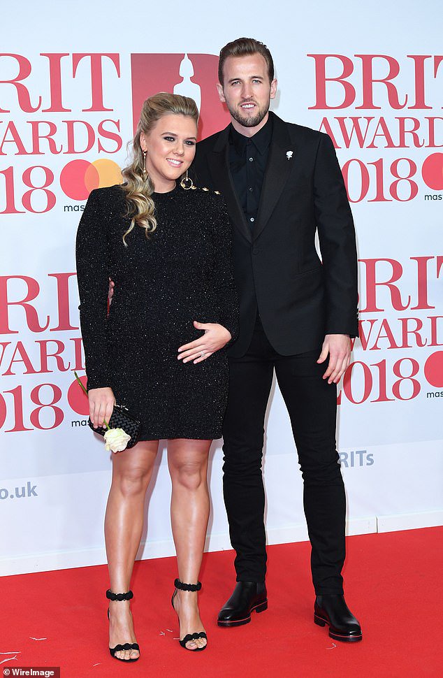 Katie showed off her baby bump in another black ensemble when they attended the Brit Awards in 2018 after confirming she was expecting her second child with the striker