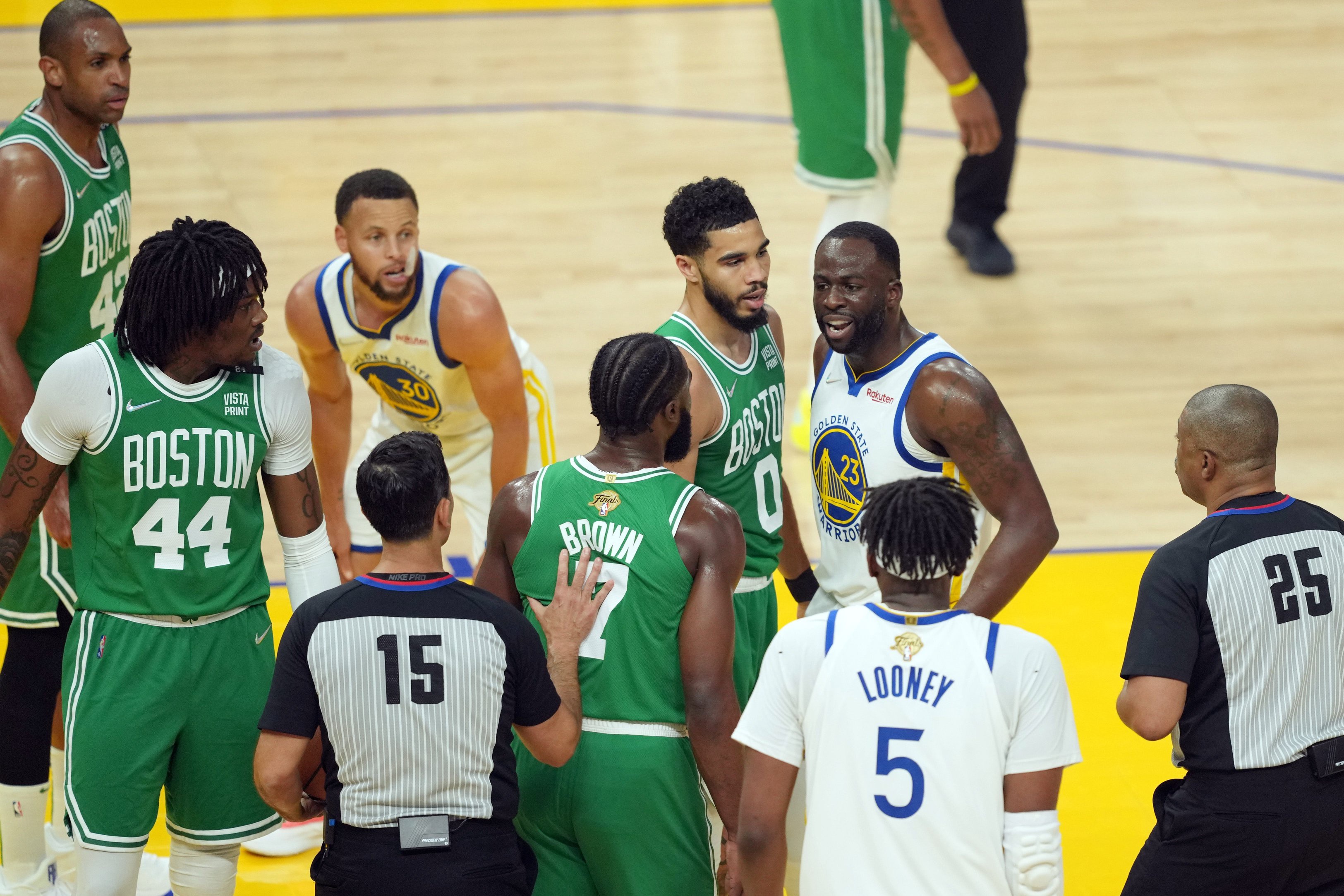 Jun 5, 2022; San Francisco, California, USA; Golden State Warriors forward Draymond Green (23) has words with Boston Celtics forward Jayson Tatum (0) and guard Jaylen Brown (7) in the first quarter during game two of the 2022 NBA Finals at Chase Center. Mandatory Credit: Darren Yamashita-USA TODAY Sports