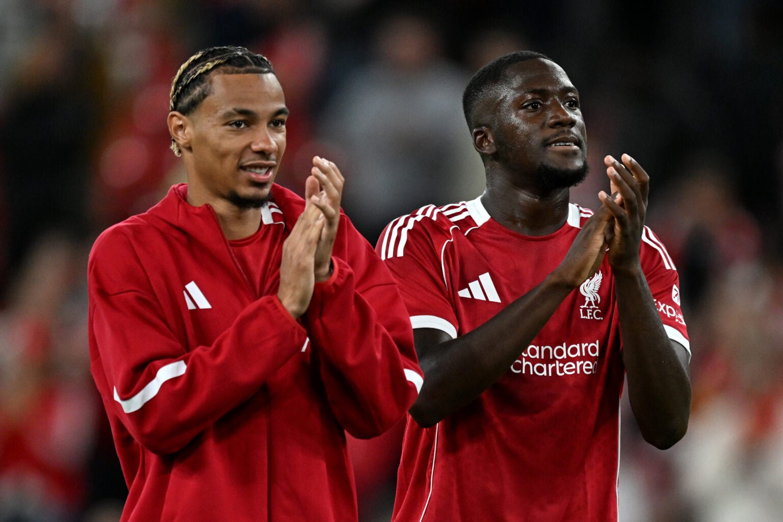 Hugo Ekitike and Ibrahima Konate of Liverpool applaud the fans after the second pre-season friendly match between Liverpool and Athletic Club Bilbao at Anfield.
