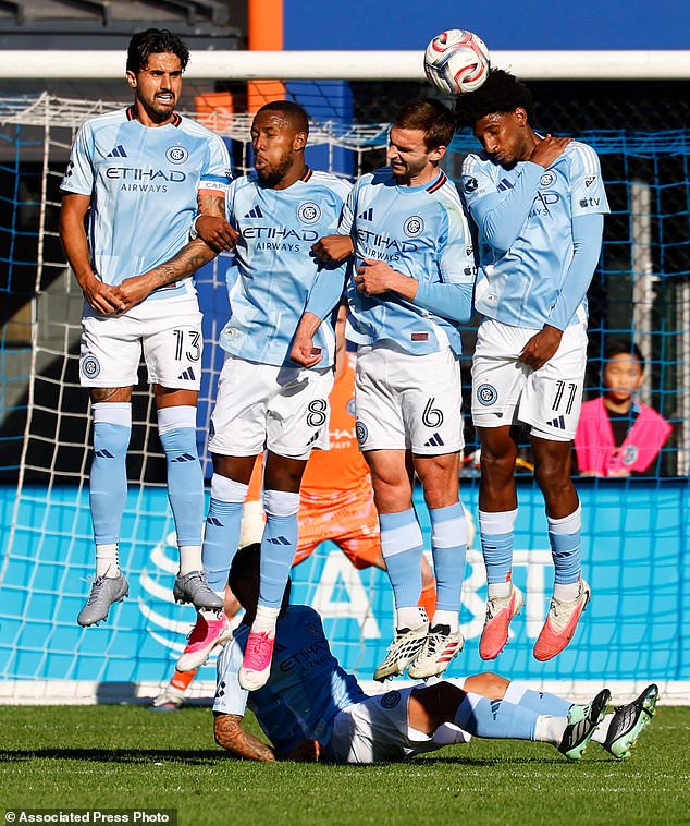 New York City FC defender Thiago Martins (13), midfielder Andrés Perea (8) defender James Sands (6) and forward Talles Magno (11) defend against a direct kick by CF Montréal during the second half of an MLS soccer match, Saturday, Oct. 31, 2026, in New York. (AP Photo/Noah K. Murray)