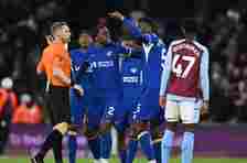 Chelsea players protest to referee Craig Pawson during the draw with Aston Villa