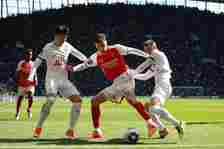 Kai Havertz of Arsenal holds off Son Heung-min and Giovani Lo Celso of Tottenham Hotspur  during the Premier League match between Tottenham Hotspur...