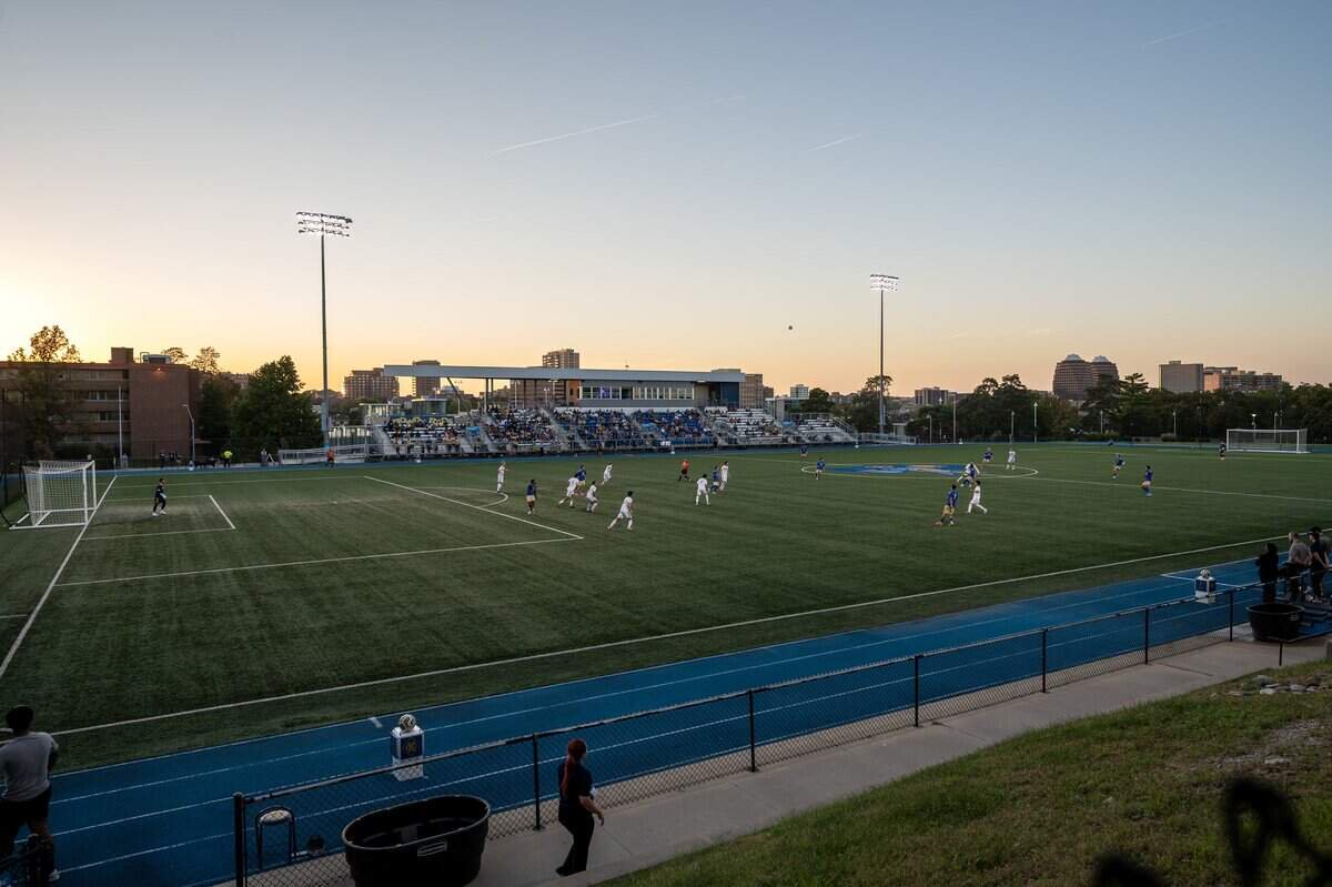 UMKC Roos and Tulsa Golden Hurricane players compete beneath a setting sun at Stanley H. Durwood Soccer Stadium and Recreational Field on Wednesday, Oct. 7, 2026, in Kansas City.