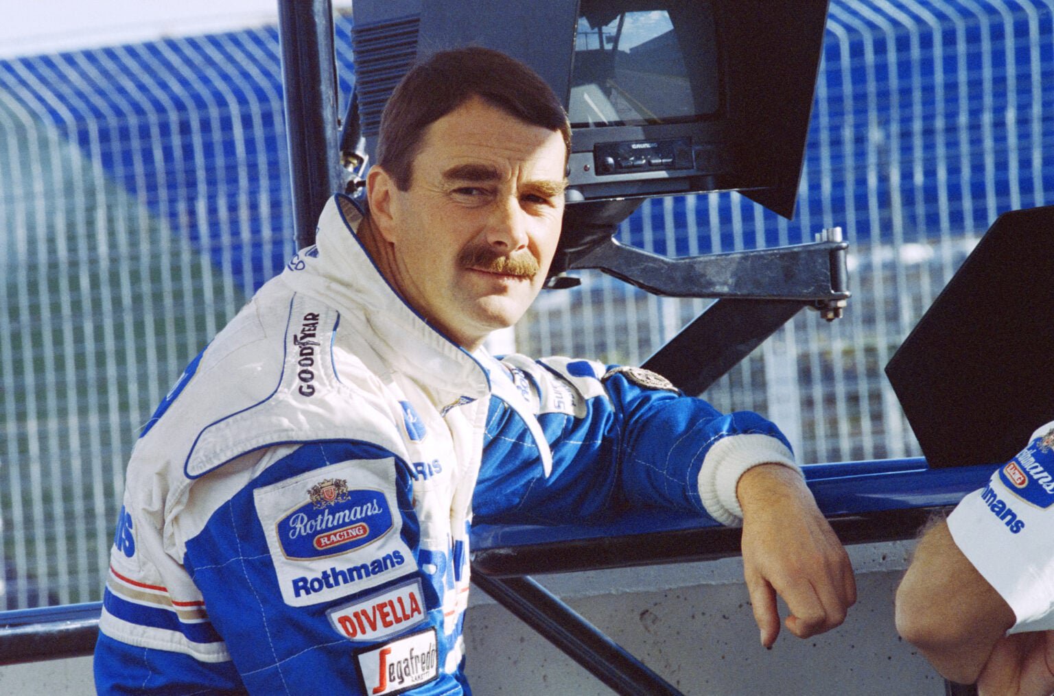 Williams driver Nigel Mansell sitting on the pit wall at the 1994 Spanish Grand Prix