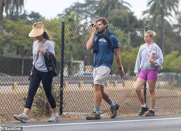 The 29-year-old son of the champion bodybuilder was seen on an outing in Los Angeles with his mother Maria Shriver and his girlfriend on Sunday