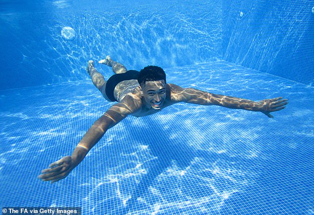 The Borussia Dortmund midfielder showed off his best swimming stroke at the team hotel