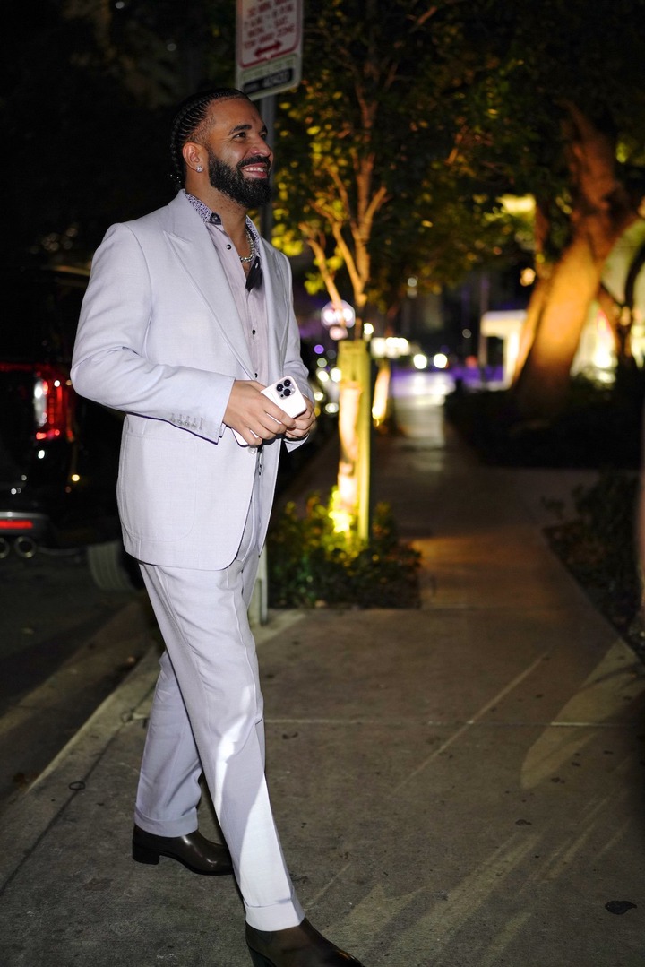 Drake wears lavender suit for birthday party at Sexy Fish