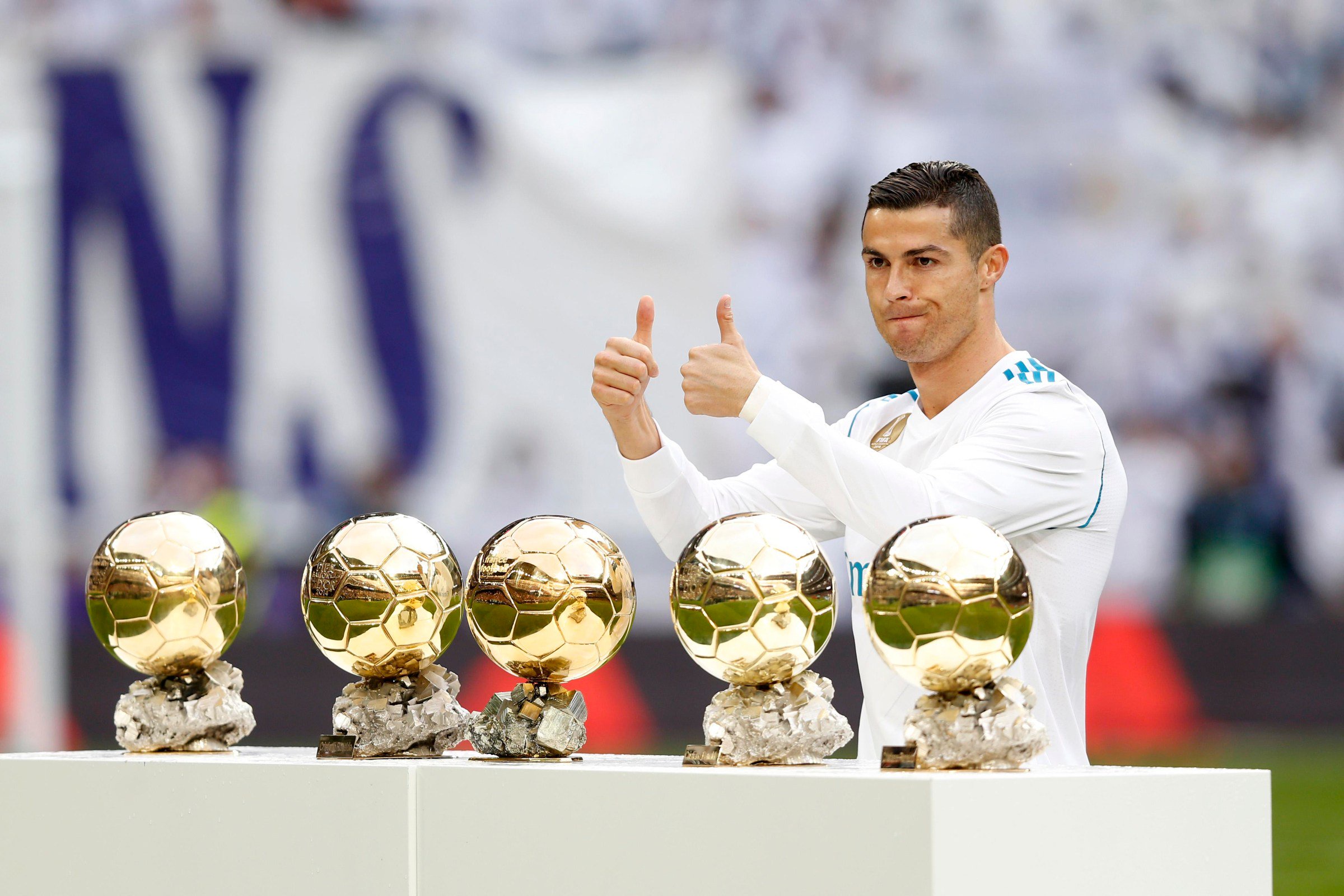 MADRID, SPAIN - DECEMBER 09: Cristiano Ronaldo of Real Madrid poses with his five Ballon d’Or trophies before the La Liga match between Real Madrid and Sevilla at Estadio Santiago Bernabeu on December 9, 2017 in Madrid, Spain. (Photo by Victor Carretero/Real Madrid via Getty Images)
