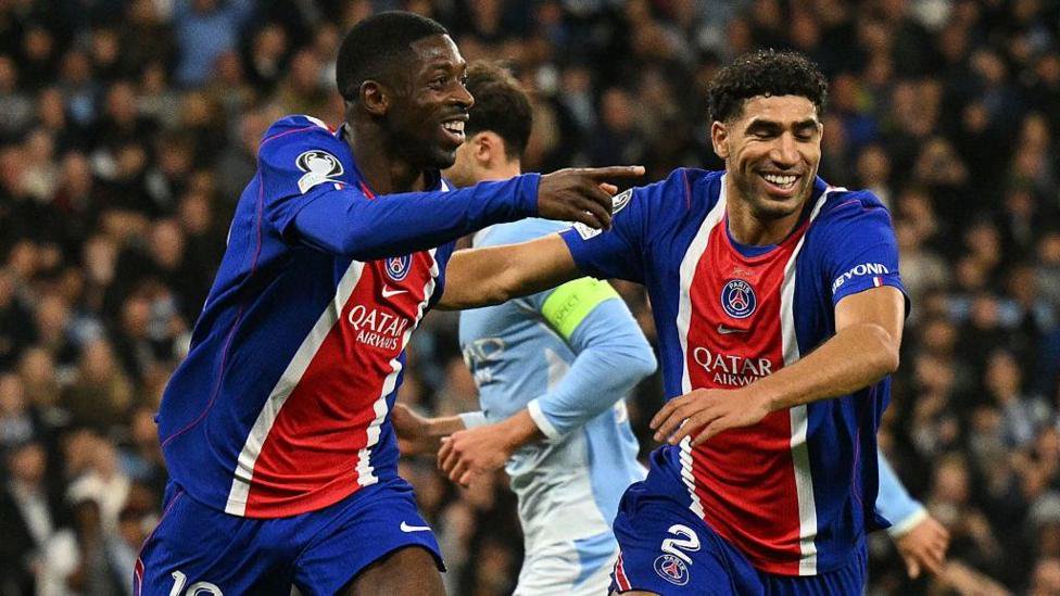Ousmane Dembele and Achraf Hakimi celebrate PSG's goal against Manchester City