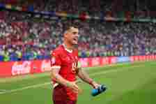 Granit Xhaka of Switzerland celebrates after the team's victory and progression to the quarter final in the UEFA EURO 2024 round of 16 match betwee...