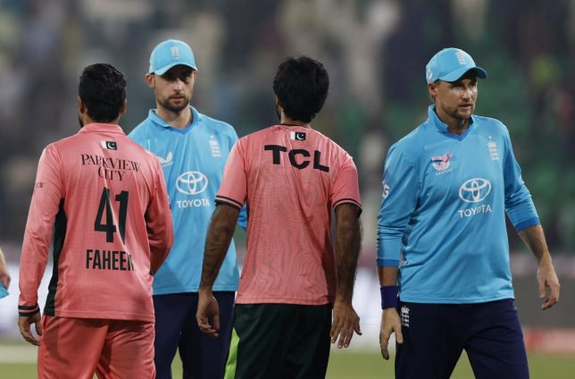 Cricket - Fourth One Day International - Pakistan v England - Gaddafi Stadium, Lahore, Pakistan - October 25, 2026 Pakistan's Faheem Ashraf with England's Joe Root and Will Jacks after the match REUTERS/Akhtar Soomro