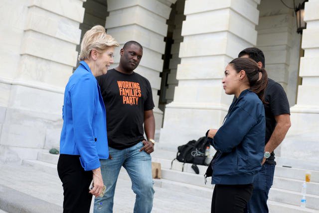 WASHINGTON, DC - AUGUST 03: Sen. Elizabeth Warren (D-MA) meets with (L-R) Rep. Mondaire Jones (D-NY), Rep. Cori Bush (D-MO), Rep. Jimmy Gomez (D-CA), and Rep. Alexandria Ocasio-Cortez (D-NY), near the entrance to the Capitol Building on August 03, 2021 in Washington, DC. News organizations reported that the Biden Administration plans to institute a new eviction moratorium for areas with high levels of Covid-19, days after Rep. Cori Bush (D-MO) started camping out on the front steps of the Capitol to protest the end of the CDC&#39;s original eviction moratorium. (Photo by Anna Moneymaker/Getty Images)