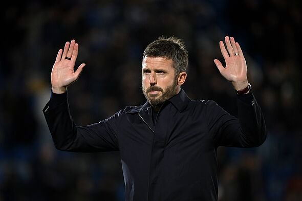 Manchester United coach Michael Carrick hands up