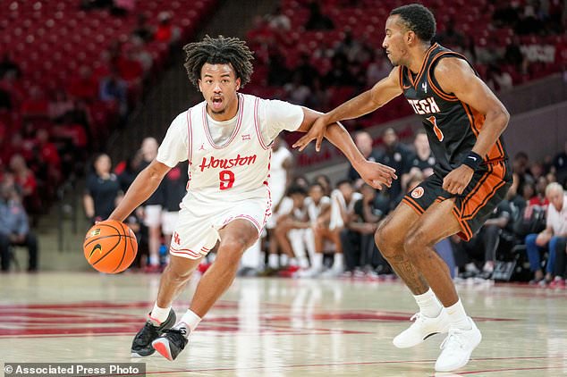 Houston guard Dedan Thomas Jr. (9) dribbles as Montana Tech guard Alan Kane, right, defends during the first half of an NCAA college basketball exhibition game Thursday, Oct. 15, 2026, in Houston. (AP Photo/Eric Christian Smith)