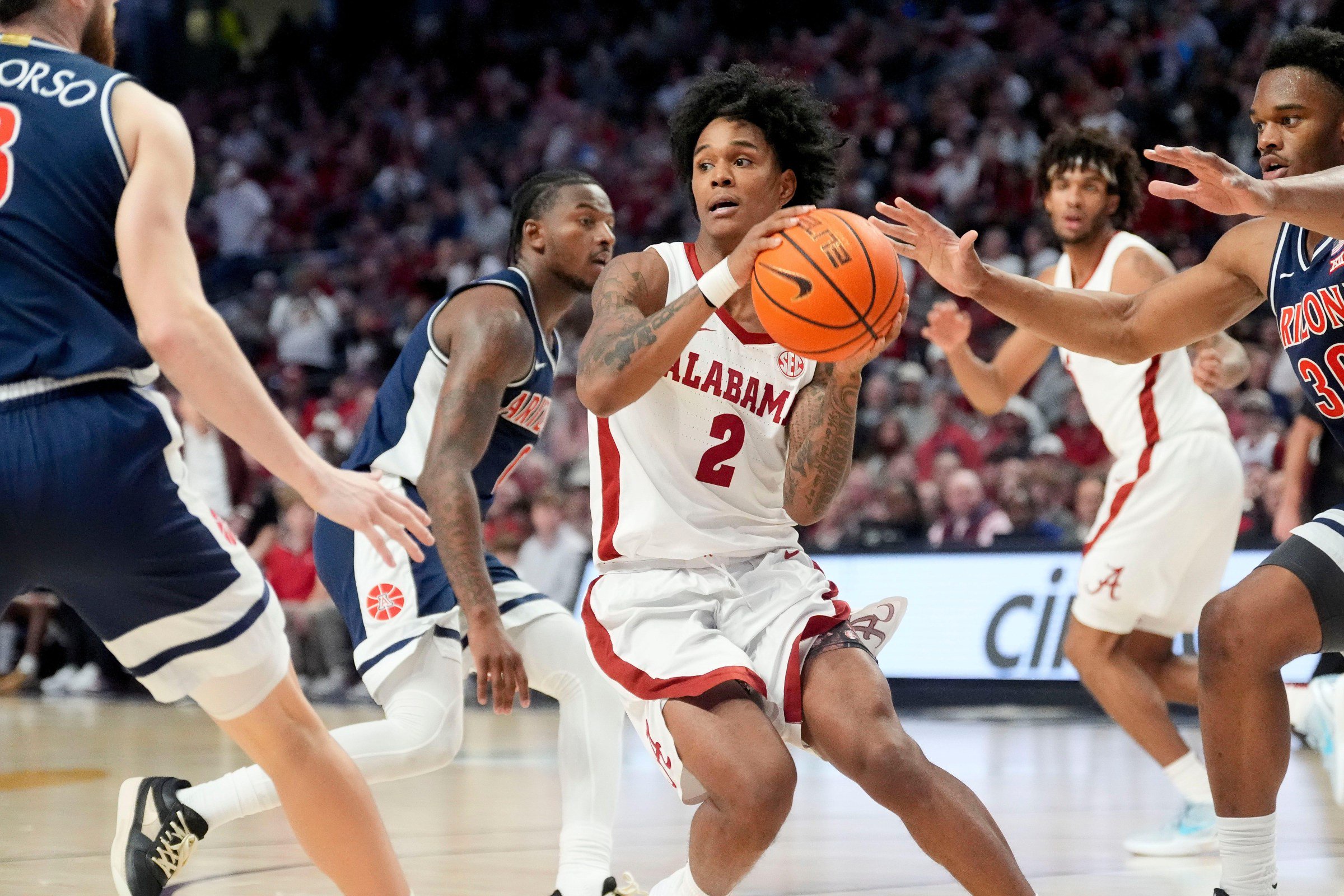 Dec 13, 2025; Birmingham, AL, USA; Alabama guard Aden Holloway (2) drives into the lane and looks to pass at Legacy Arena. Mandatory Credit: Gary Cosby Jr.-Tuscaloosa News