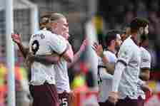 Manchester City's Erling Haaland (L) celebrates with teammates after scoring their second goal vs Forest