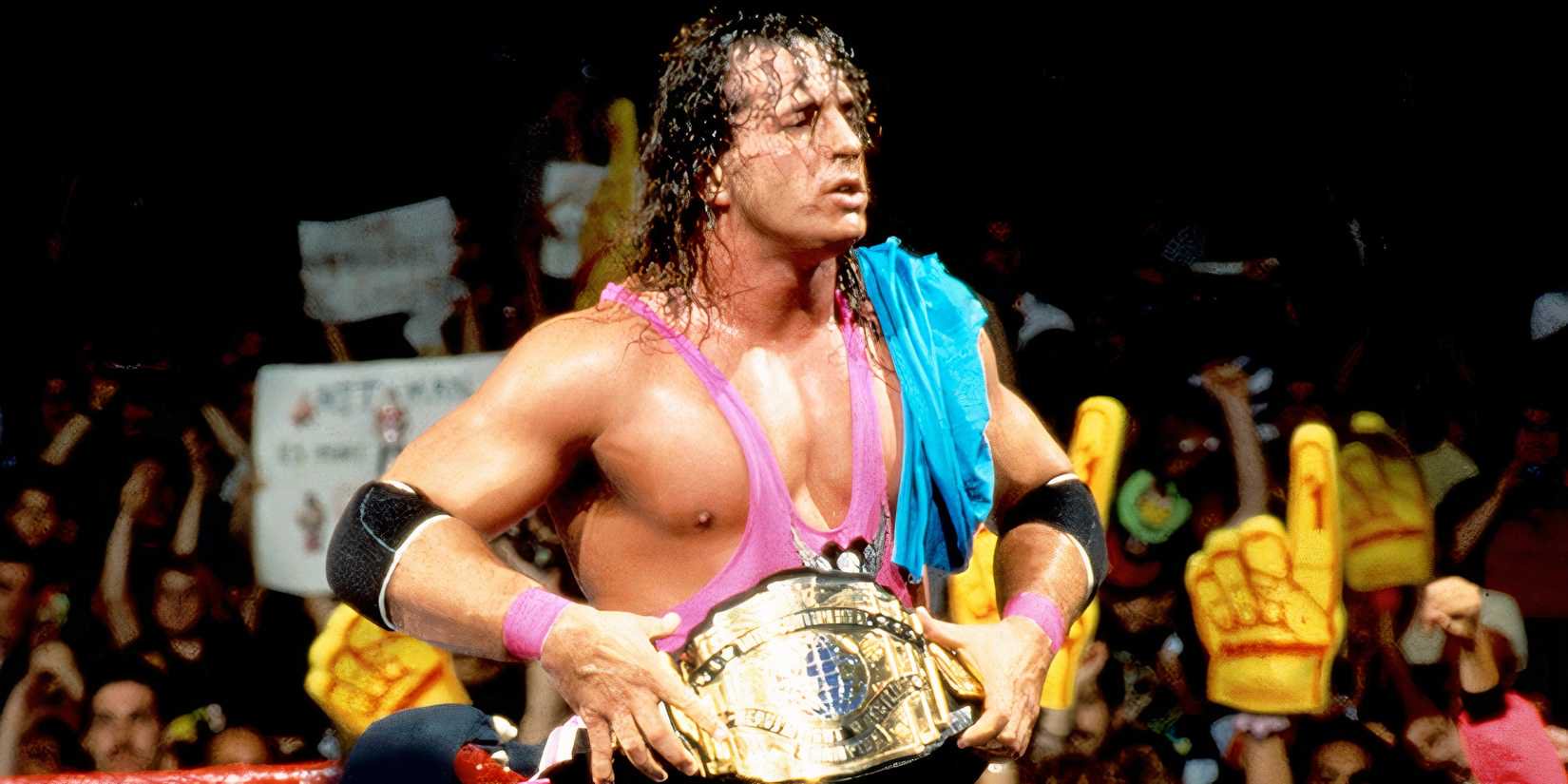 Bret Hart poses with the Intercontinental Championship after a match.