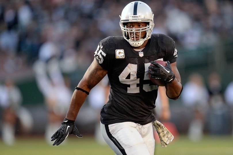 Marcel Reece #45 of the Oakland Raiders carries the ball against the Tennessee Titans during the third quarter at O.co Coliseum on November 24, 2013 in Oakland, California. The Titans won the game 23-19.