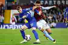 Morgan Rogers and Cole Palmer battle for the ball as Aston Villa drew with Chelsea