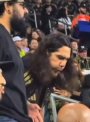 A Los Angeles FC fan was caught spitting on a rival female fan during Sunday's game