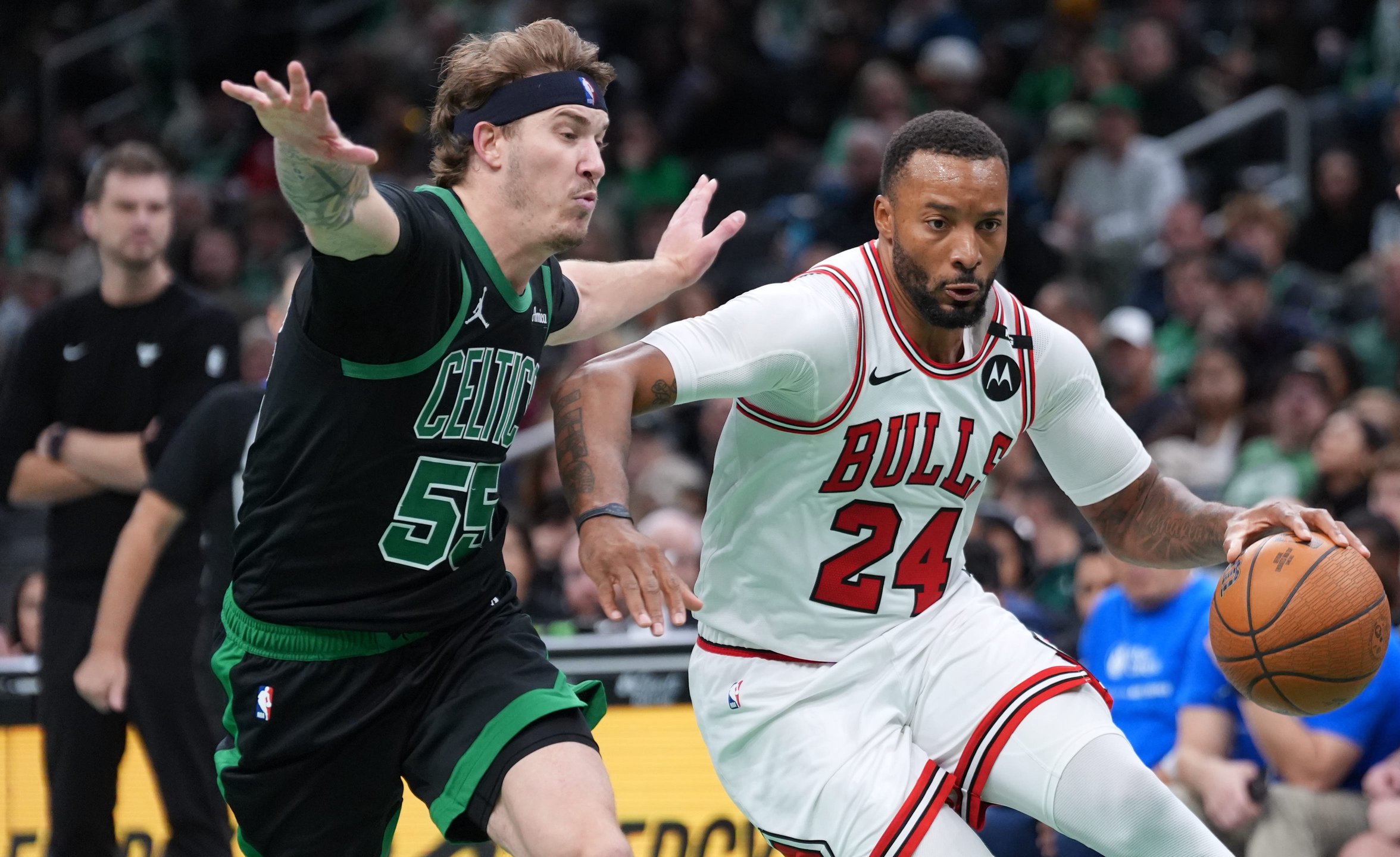 Oct 30, 2026; Boston, Massachusetts, USA; Chicago Bulls guard Norman Powell (24) drives the ball against Boston Celtics guard Baylor Scheierman (55) in the second half at TD Garden. Mandatory Credit: David Butler II-Imagn Images