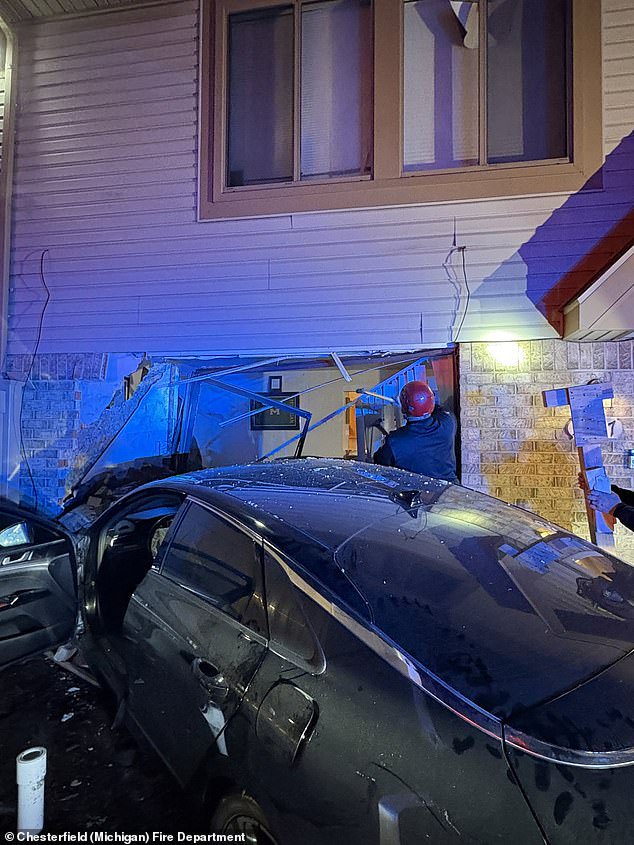 Close call: The car smashed into the front of the house, narrowly missing the football fan