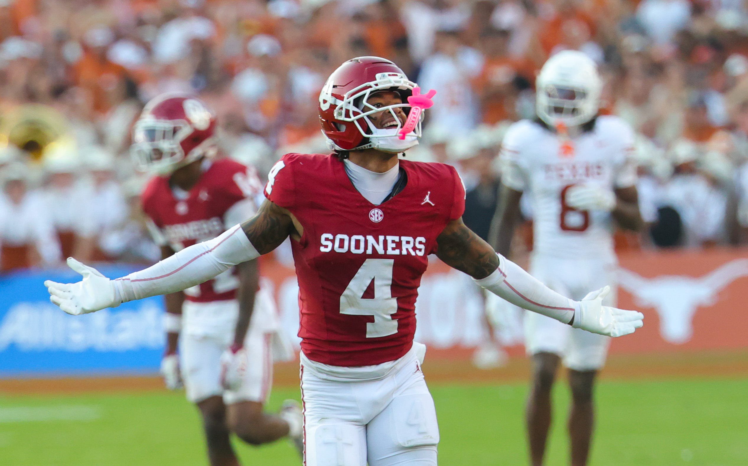 Oct 10, 2026; Dallas, Texas, USA; Oklahoma Sooners defensive back Courtland Guillory (4) reacts after making an interception during the second half against the Texas Longhorns at the Cotton Bowl. Mandatory Credit: Kevin Jairaj-Imagn Images
