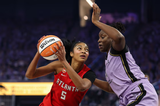 Angel Reese #5 of the Atlanta Dream looks to shoot the ball against Aminata Gueye #31 of the Golden State Valkyries.