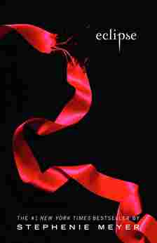 A fraying red ribbon across the cover of Twilight Eclipse book cover.