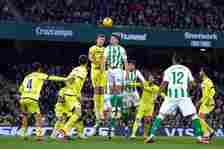 Marc Roca of Real Betis competes for the ball with Alexander Sorloth of Villarreal CF during the LaLiga EA Sports match between Real Betis and Vill...