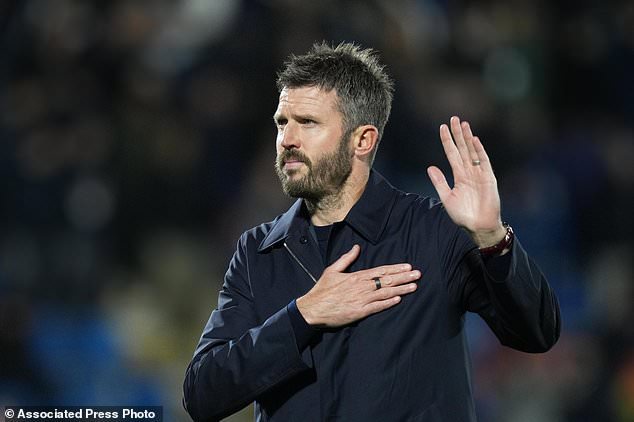 Manchester United's head coach Michael Carrick gestures as he leaves the pitch after the Champions League opening phase soccer match between Como and Manchester United in Como, Italy, Wednesday, Oct. 21, 2026. (AP Photo/Antonio Calanni)