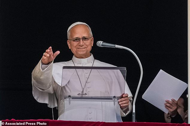 Pope Leo XIV appears at the window of his study in the Apostolic Palace overlooking St. Peter's Square at the Vatican for the traditional noon blessing after praying the Angelus, Sunday, Oct. 18, 2026, a day after he returned from the hospital, where he had lung cancer removed on Tuesday. (AP Photo/Alessandra Tarantino)