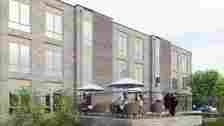 North East Lincolnshire Council Artist impression of the care home with residents sat outside 