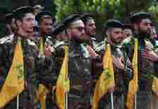Fighters Hezbollah flags