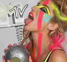 Kesha licking an award