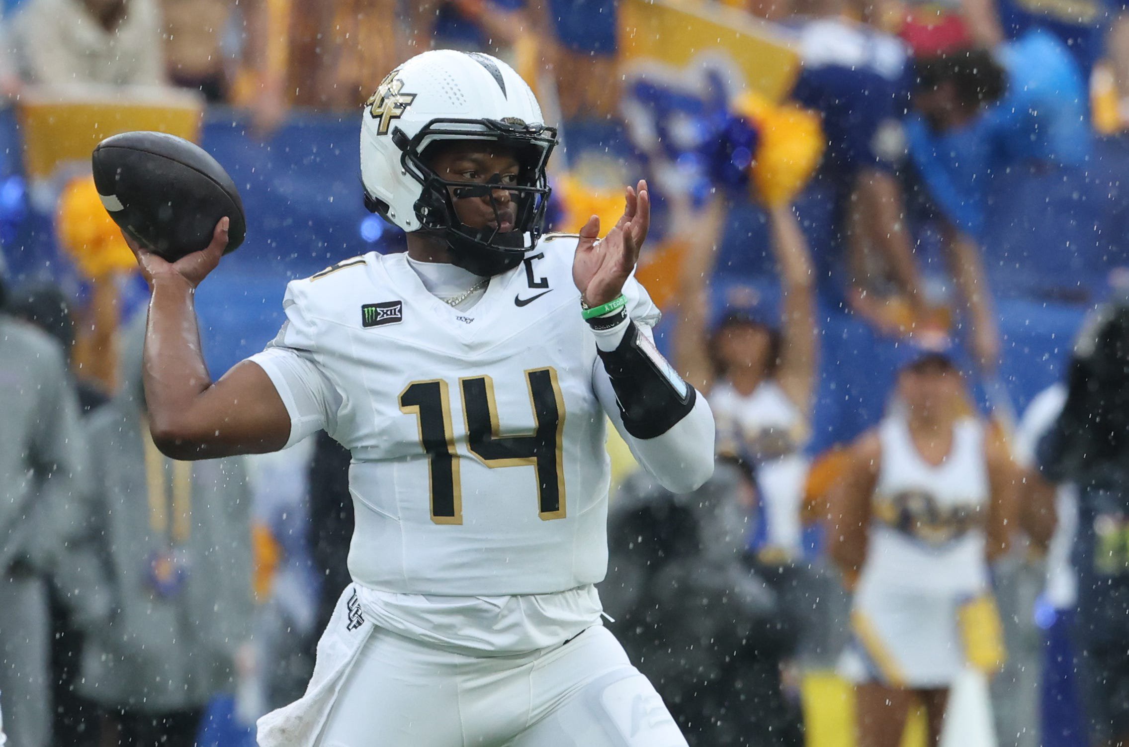 Sep 12, 2026; Pittsburgh, Pennsylvania, USA;  UCF Knights quarterback Alonza Barnett III (14) passes against the Pittsburgh Panthers during the first quarter at Acrisure Stadium.  Mandatory Credit: Charles LeClaire-Imagn Images