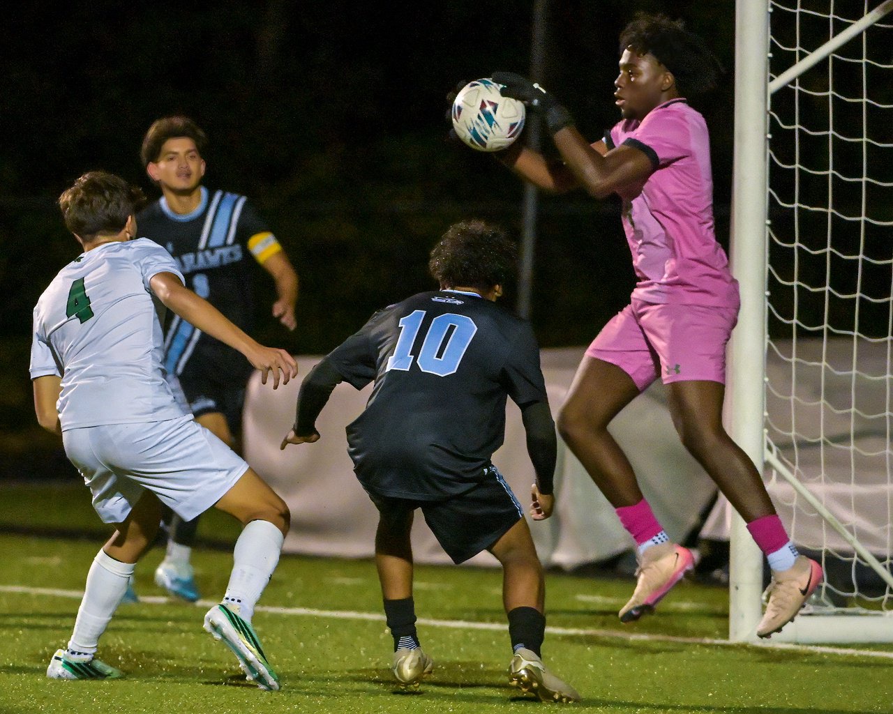 Arundel Wildcats goalkeeper Ben Anjorin #0 makes a save during the first half. The visiting Arundel Wildcats defeat the South River Seahawks, 2-1, in overtime in an MPSSAA Class 3A East II quarterfinal boys soccer game Wednesday evening. (Paul W. Gillespie/Staff)