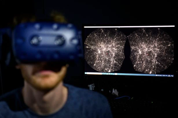 Hadrien Gurnel, software engineer EPFL's Laboratory for Experimental Museology (eM+) explores with a virtual reality helmet the most detailed 3D ma