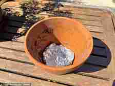 An inner reservoir can be made by placing tin foil into the bottom of the plant pot and watering the garden less frequently but water for longer periods