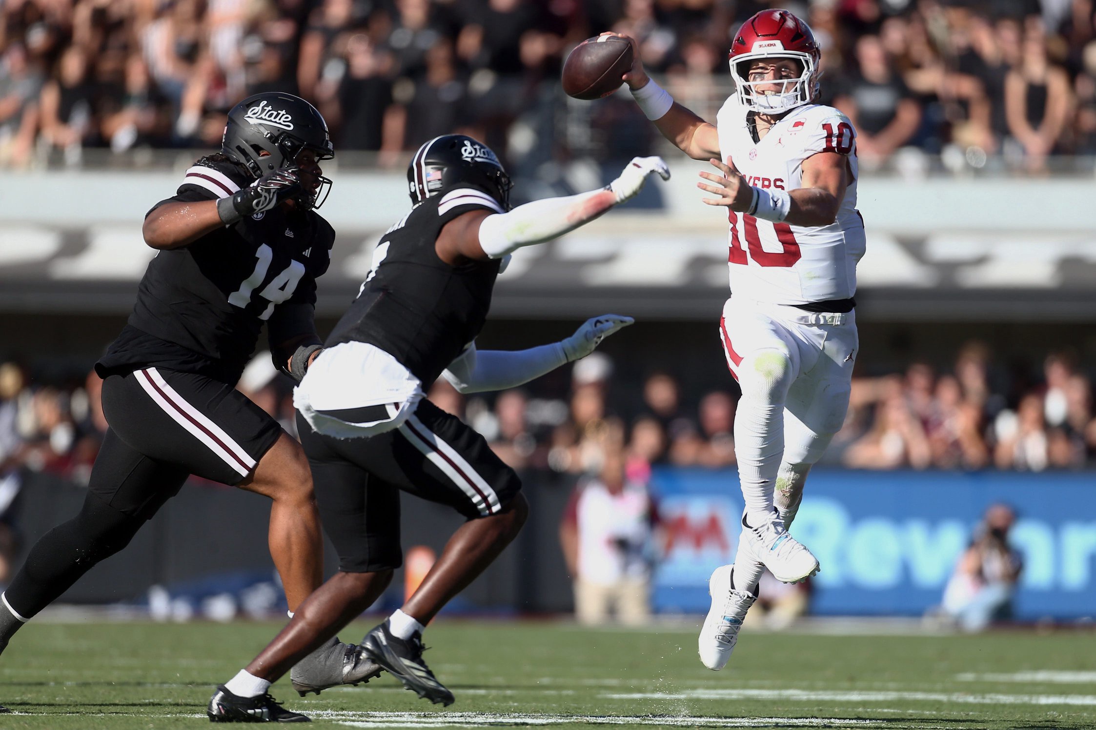 Oct 24, 2026; Starkville, Mississippi, USA;  Oklahoma Sooners quarterback John Mateer (10) passes the ball for a touchdown during the second quarter against the Mississippi State Bulldogs at Davis Wade Stadium at Scott Field.  Mandatory Credit: Petre Thomas-Imagn Images
