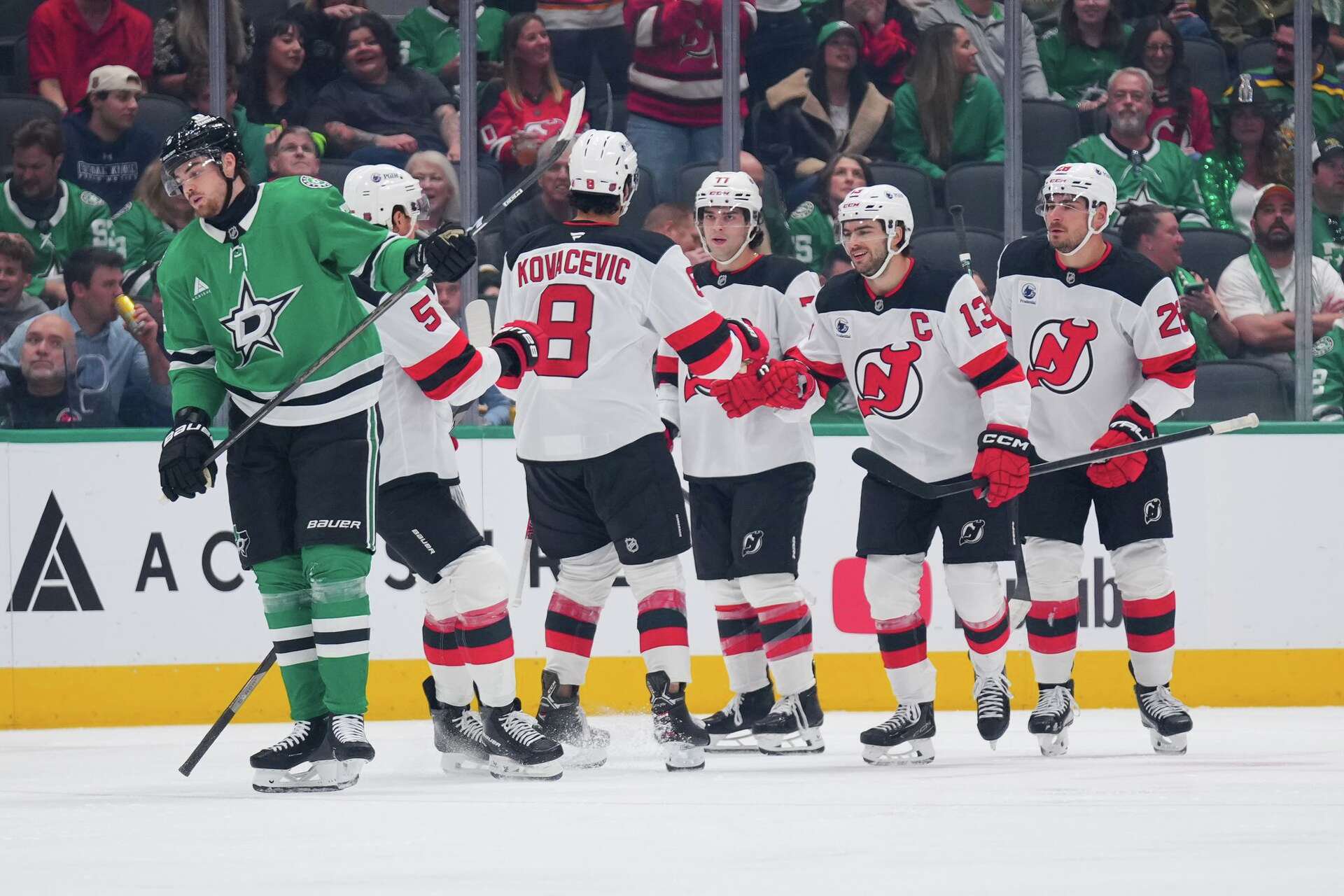New Jersey Devils center Nico Hischier (13) celebrates after scoring a goal against the Dallas Stars during the first period of an NHL hockey game Tuesday, Oct. 27, 2026, in Dallas.