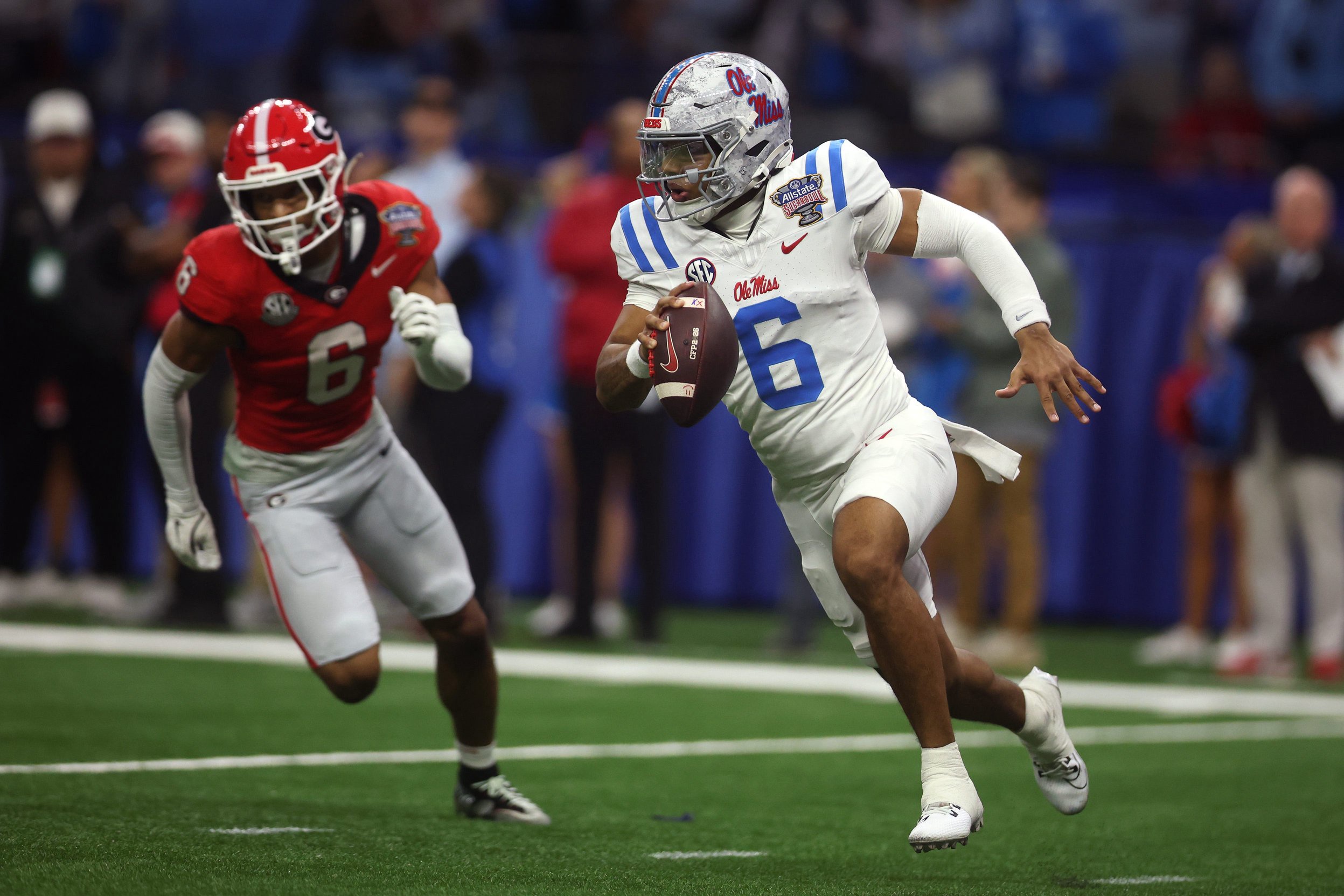 NEW ORLEANS, LOUISIANA - JANUARY 01: Trinidad Chambliss #6 of the Ole Miss Rebels scrambles during the third quarter against the Georgia Bulldogs during the 2025 College Football Playoff Quarterfinal at the Allstate Sugar Bowl at Caesars Superdome on January 01, 2026 in New Orleans, Louisiana. (Photo by Chris Graythen/Getty Images)