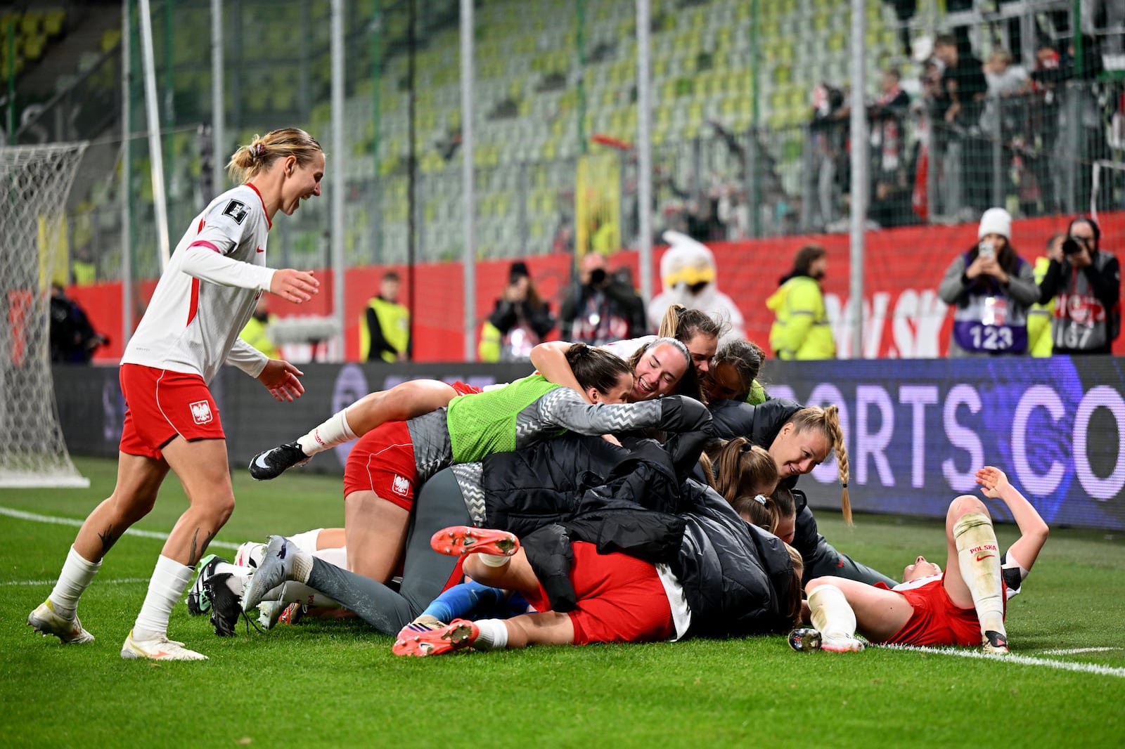 Poland players celebrate after beating Belgium 4-3 on Tuesday in the penalty shoot-out. Photograph: Mateusz Slodkowski/Getty