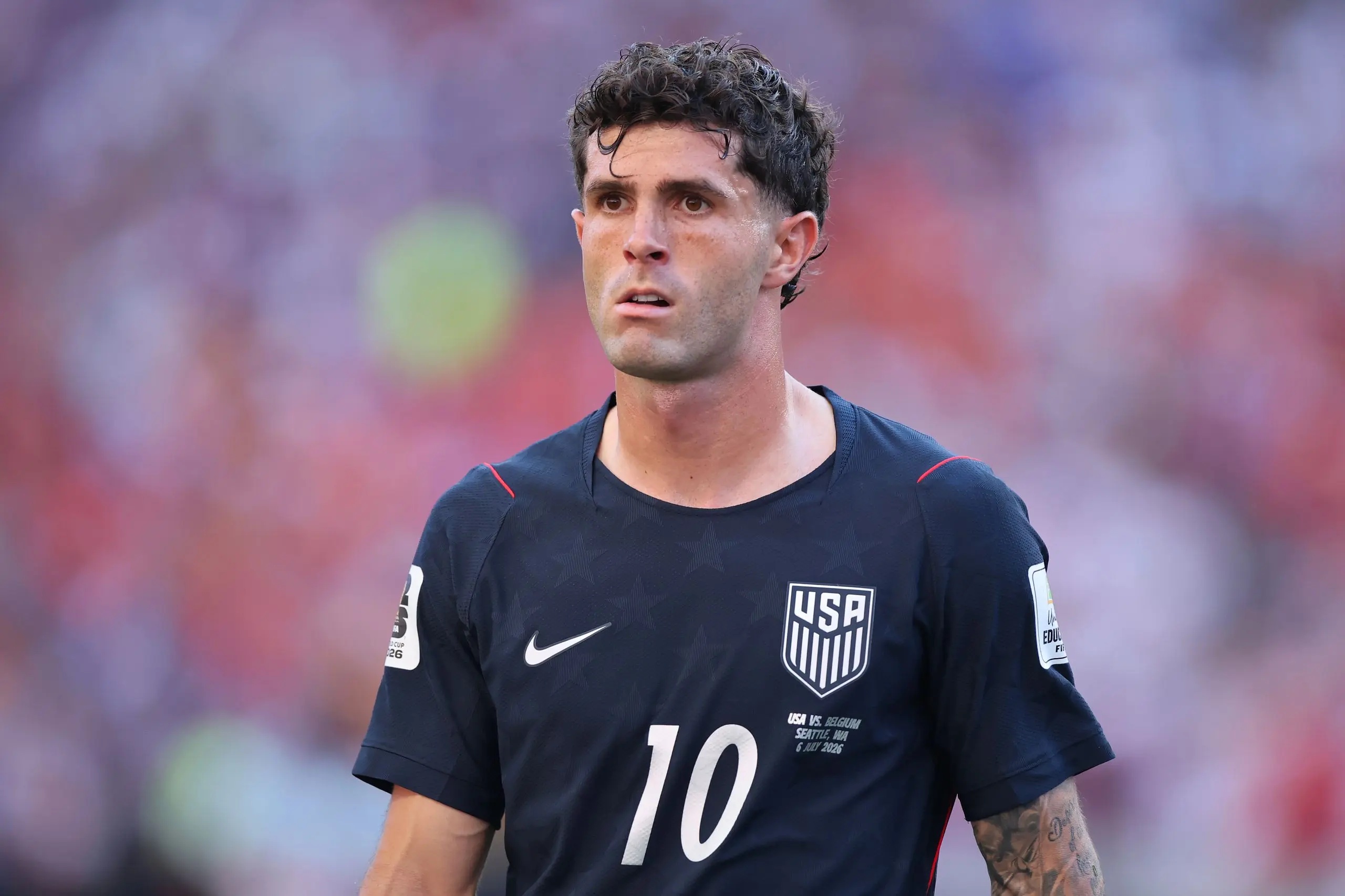 Christian Pulisic looking on.
